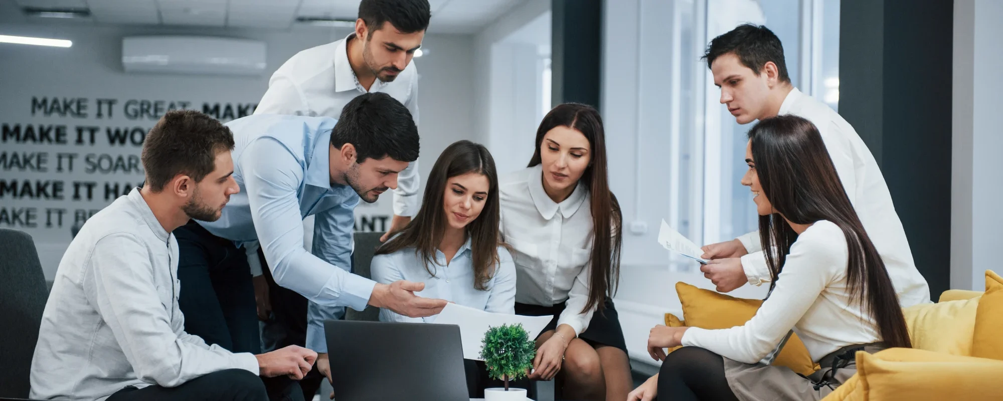 guy_shows_document_girl_group_young_freelancers_office_have_conversation_working_1