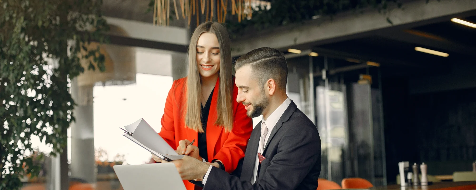partners_sitting_table_working_cafe_1